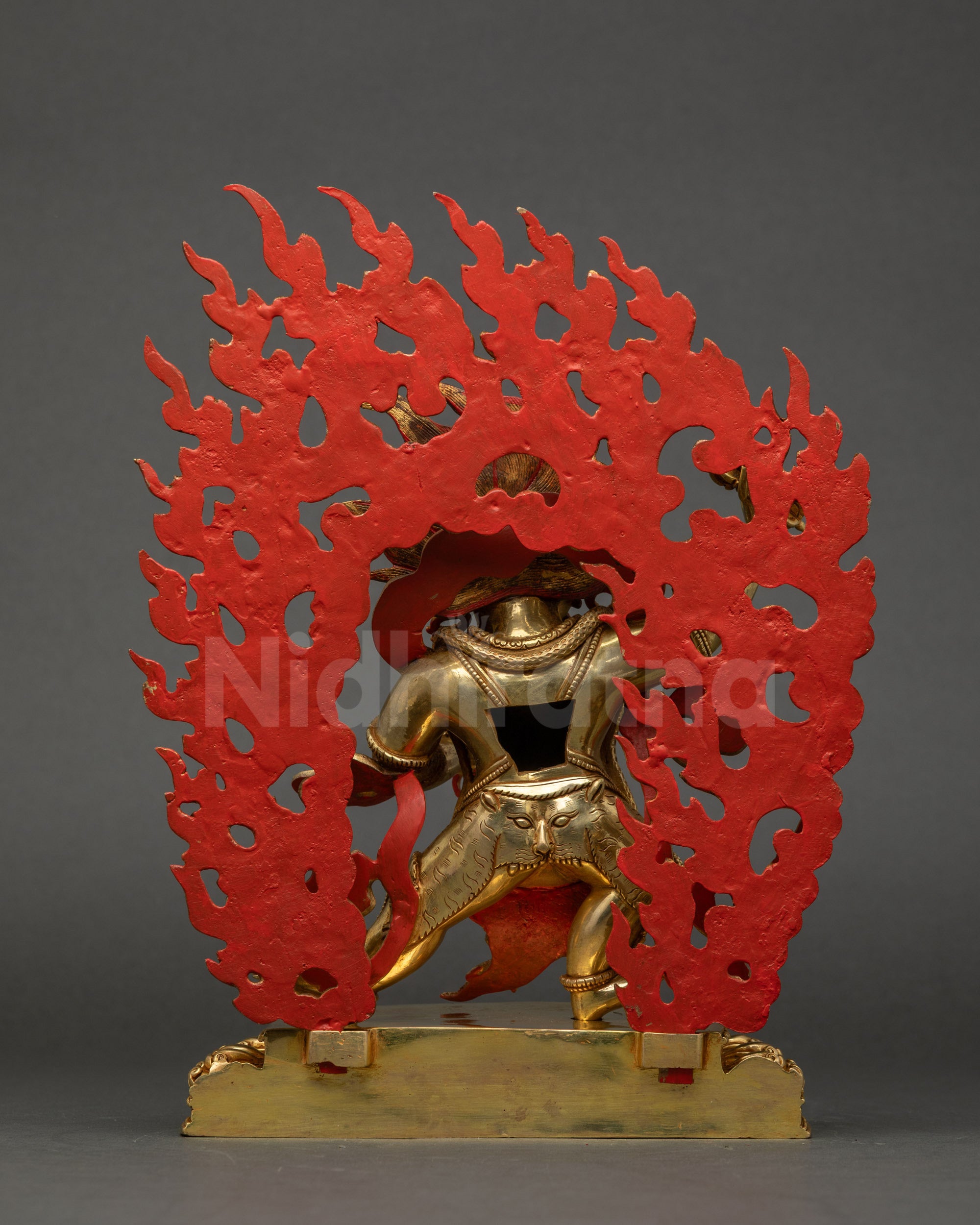 Back view of Vajrapani statue showing gold fire-gilded robe and finely carved details