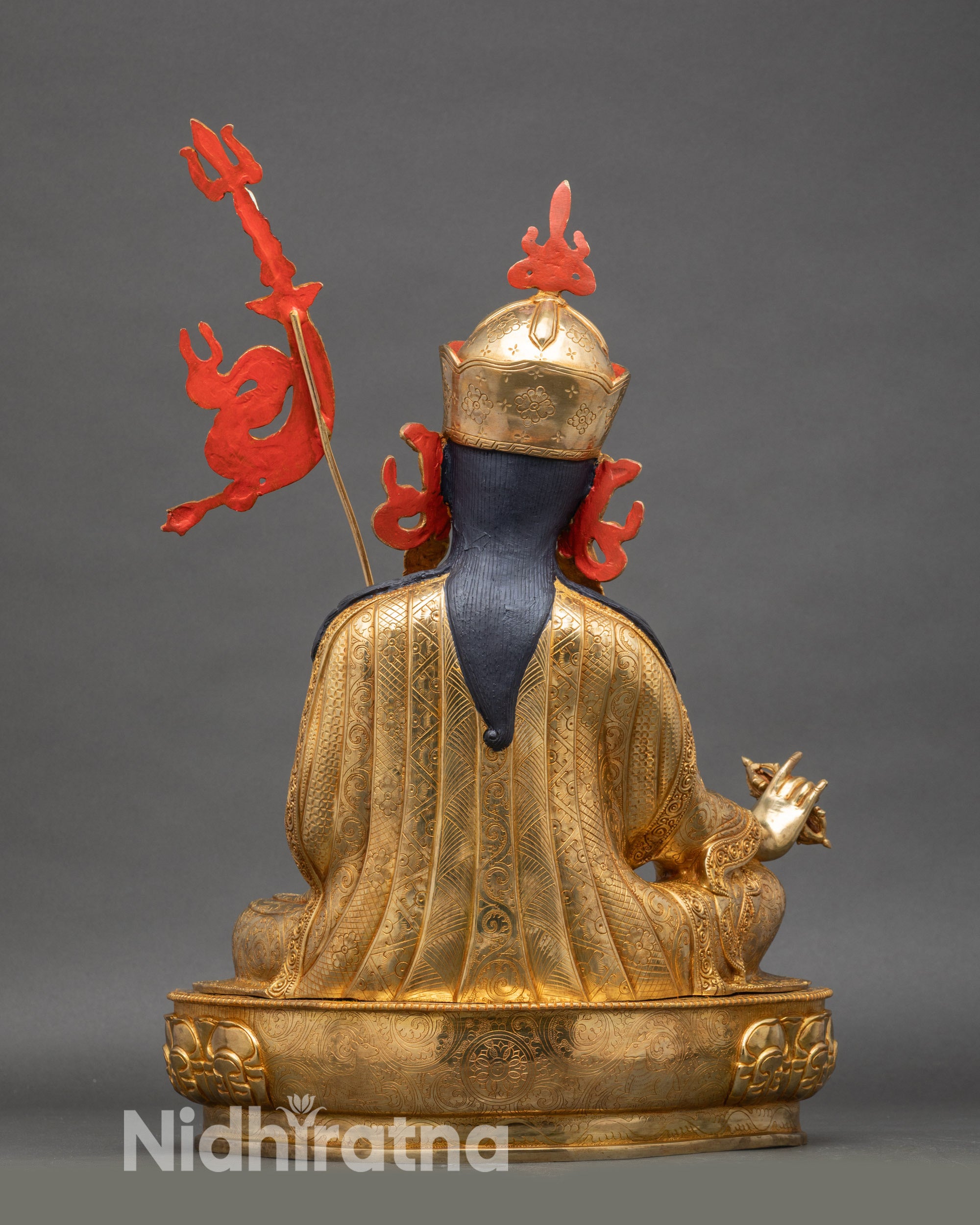 Back and side view of Padmasambhava statue with traditional robes and intricate ornaments