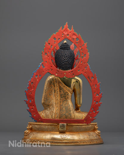 Back angle of Buddha sculpture highlighting detailed halo and lotus throne carvings