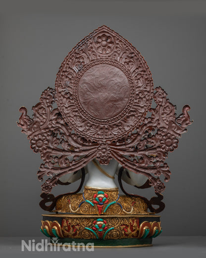 Back angle of Chenrezig Statue displaying halo with floral motifs and carved elephant