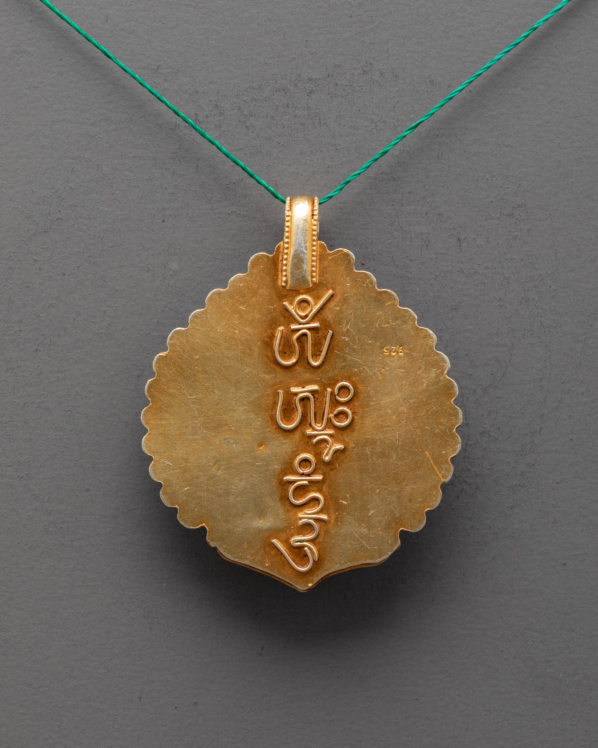 Back angle of traditional Manjushri Locket featuring detailed artisan work from Patan, Nepal
