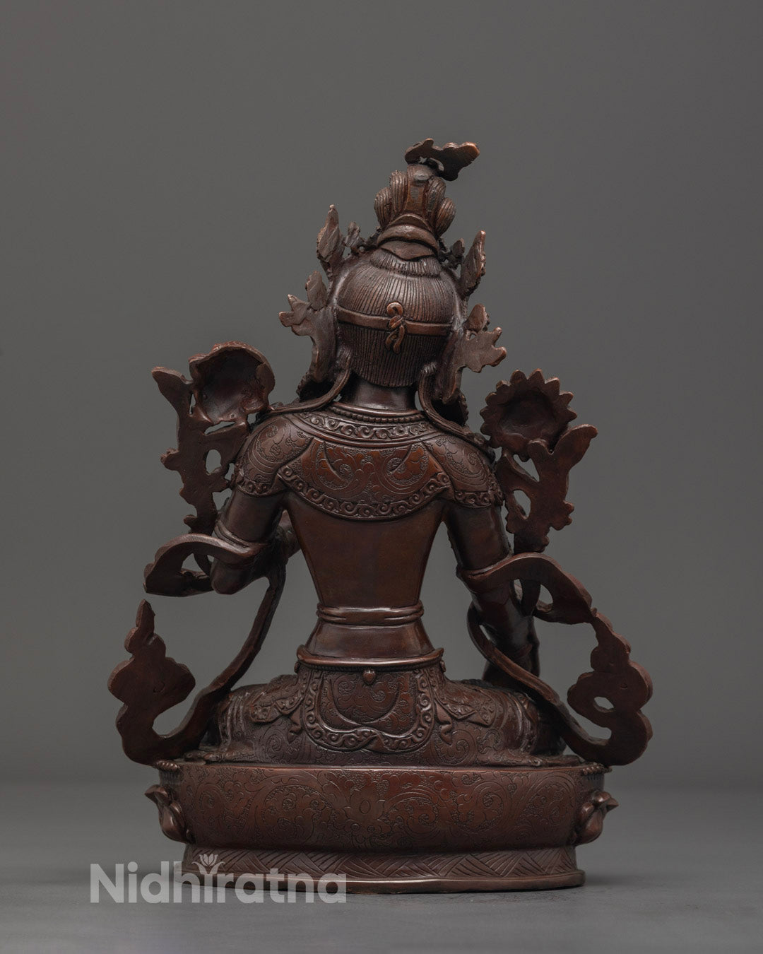 Back angle revealing intricate sacred symbols and craftsmanship of the Tibetan Buddhist White Tara statue