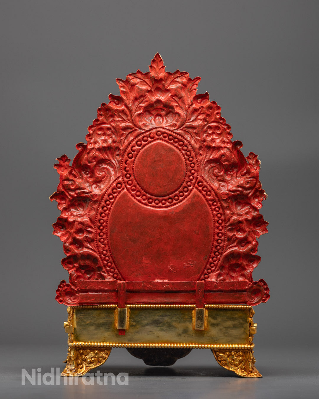 Back angle showcasing detailed carvings on the halo and ornate torana backdrop