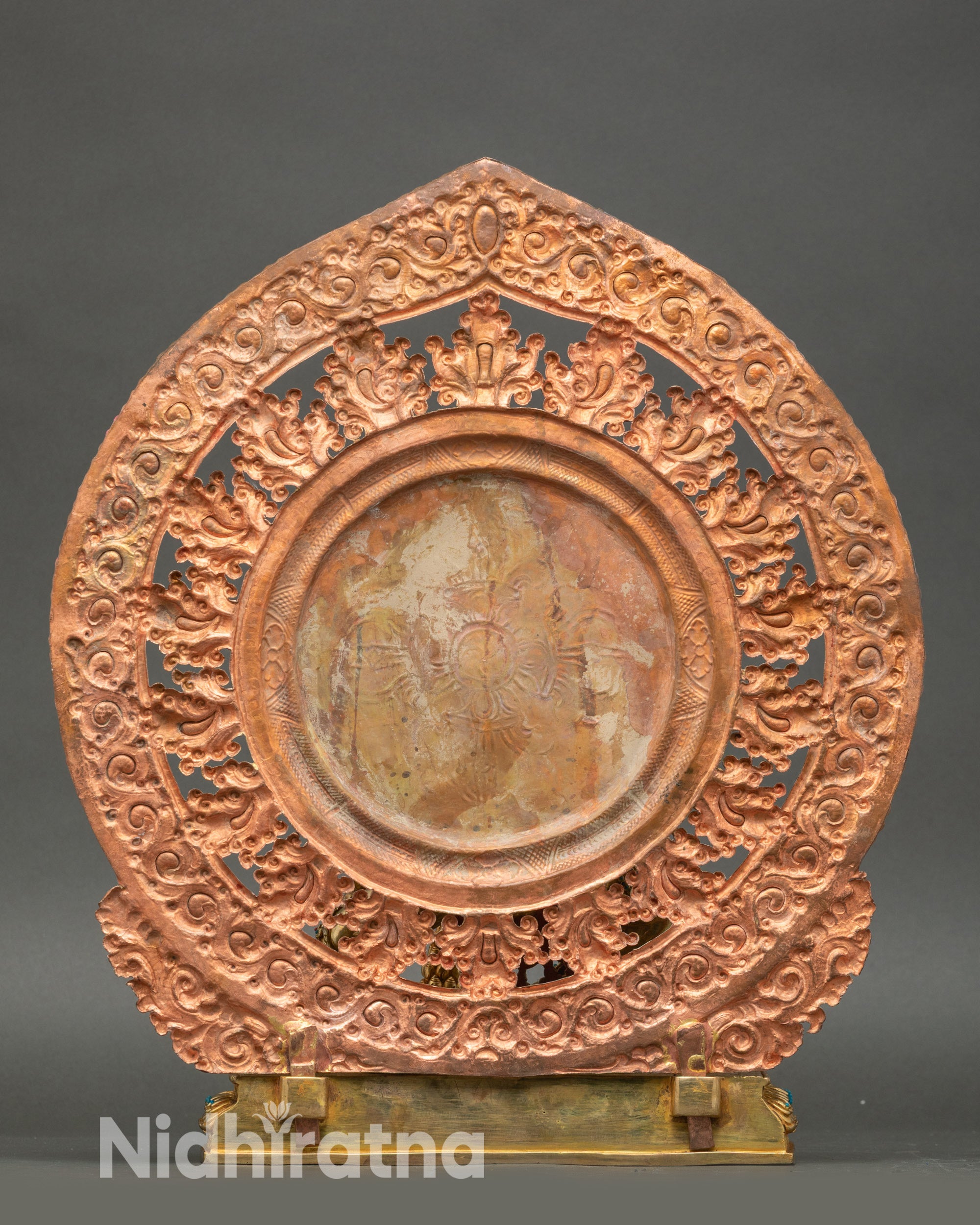 Back of Black Dzambhala statue highlighting detailed carvings and gold fire-gilding