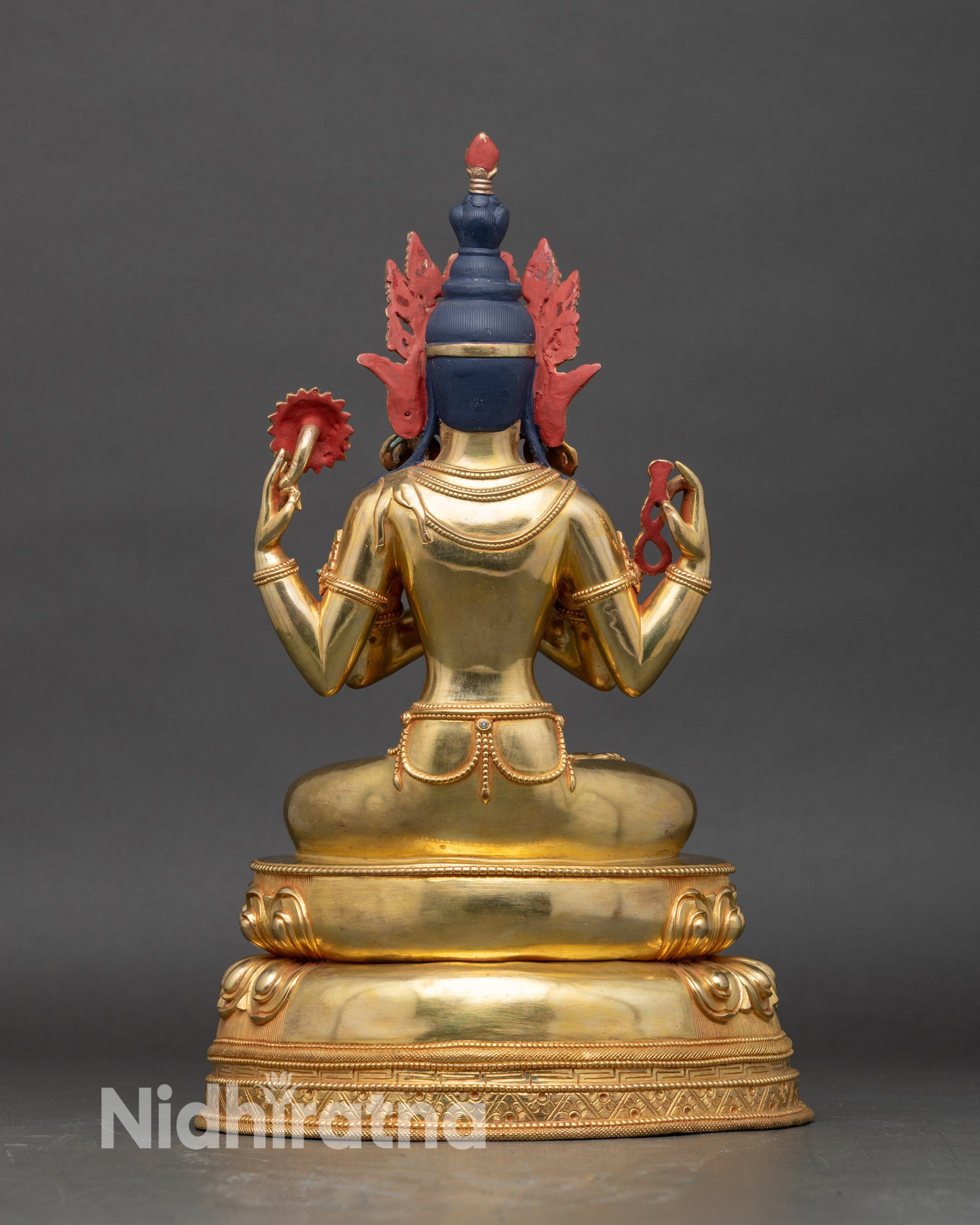 Back of Chenrezig statue with detailed folds of robes and double-layered lotus pedestal