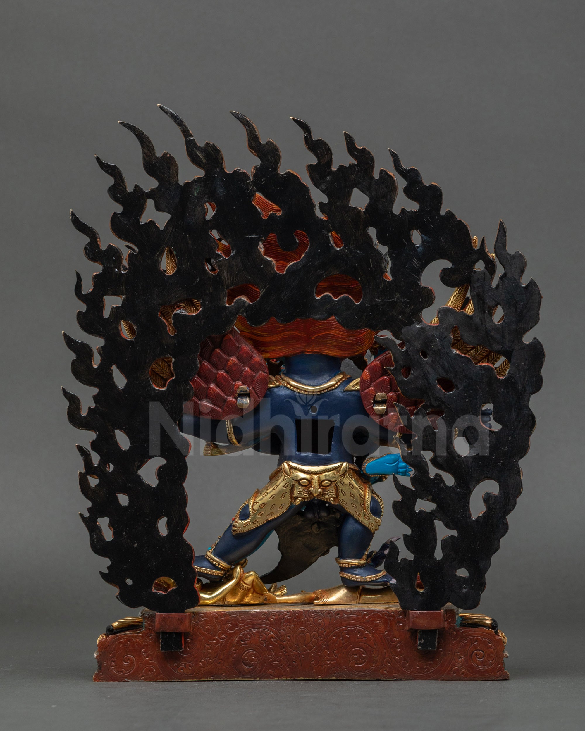 Back of Hayagriva statue with intricate halo and carved copper details