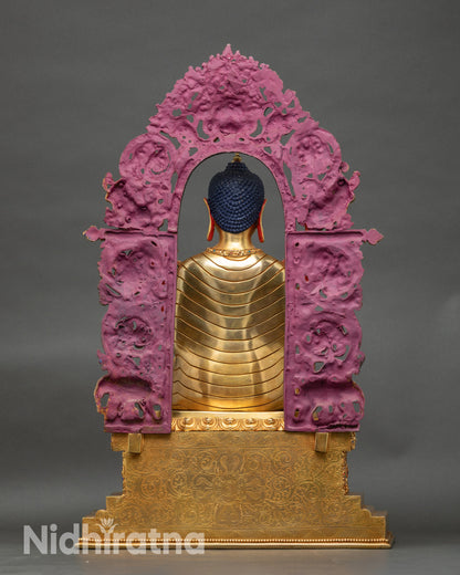 Back of Maitreya Buddha statue showing carved throne motifs, stupa finial and mythical protector details