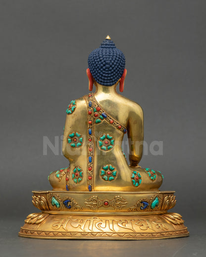 Back of Shakyamuni Buddha Statue showing detailed carvings and semi-precious stone embellishments