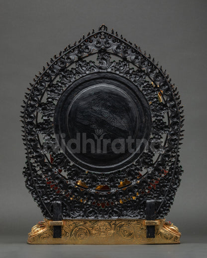 Back of Vajrapani statue highlighting detailed robe, lotus base, and halo