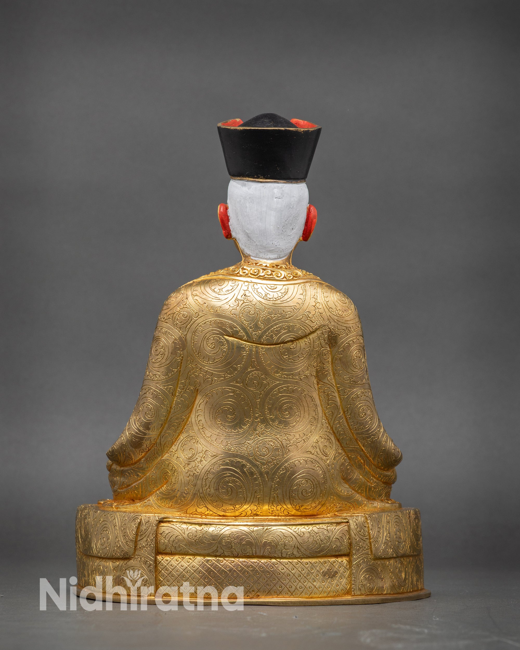 Back view 1st Karmapa Dusum Khyenpa statue monk robe carving Himalayan art