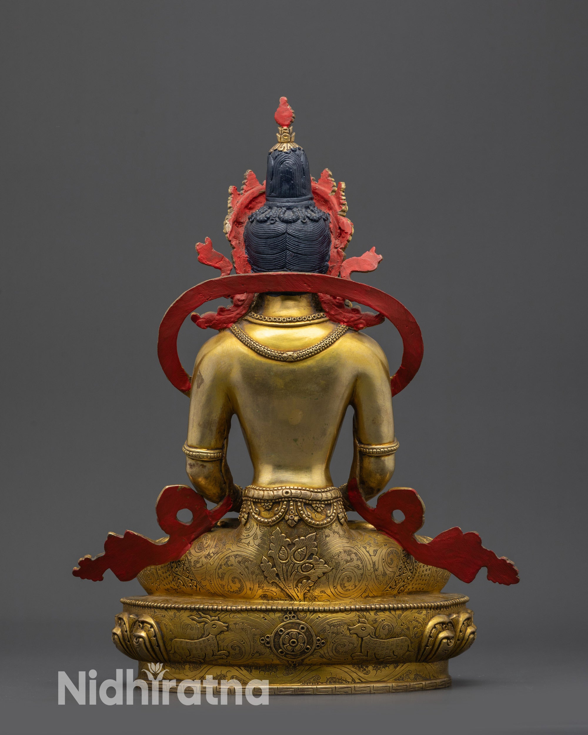 Back view Amitayus Statue highlighting gold fire-gilded copper body patterns