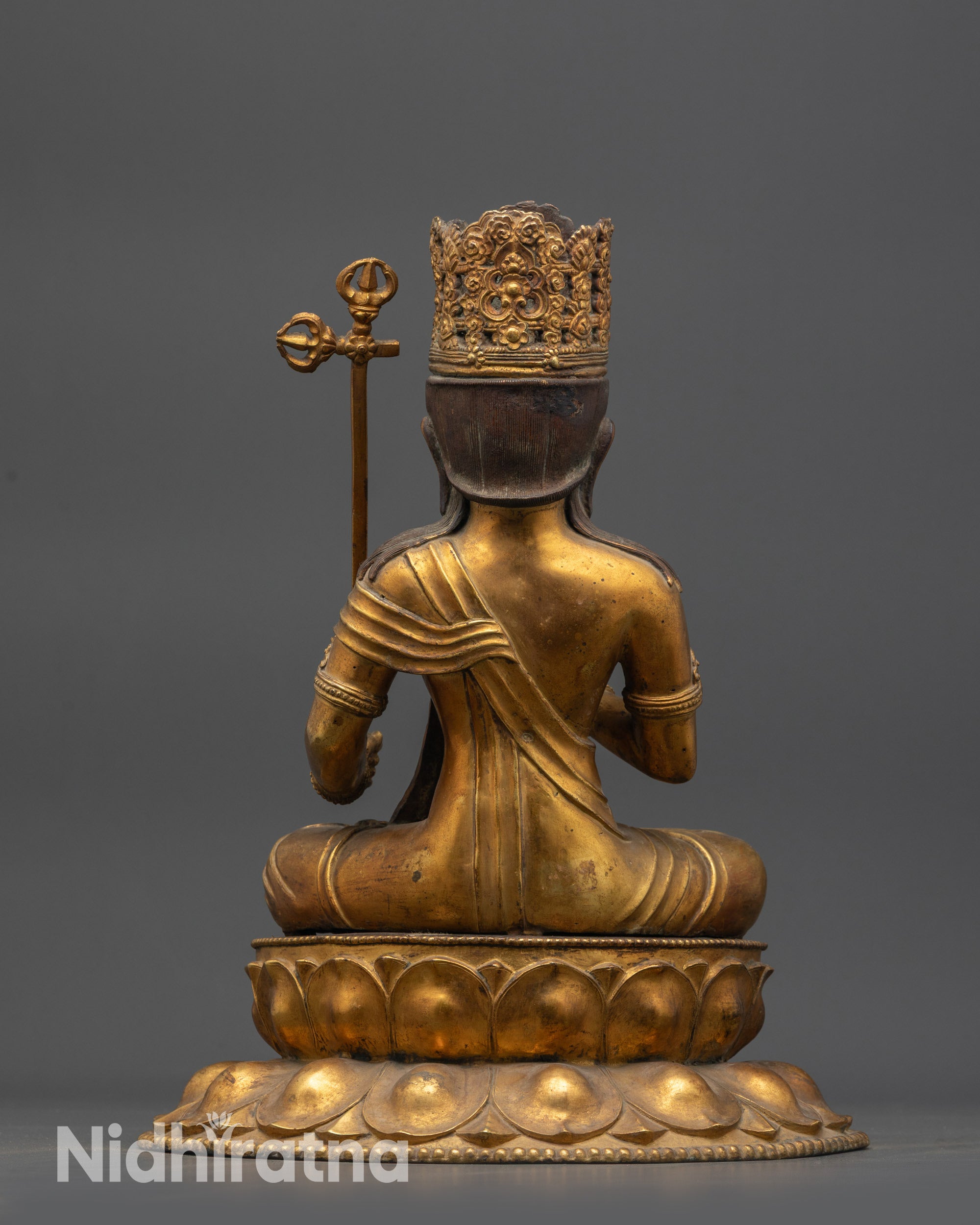 Back view Antique Nepalese Akasagarbha Statue showcasing flowing garments and copper base