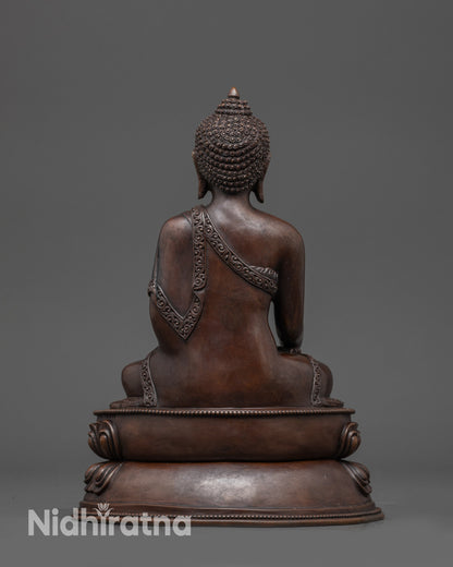 Back view: Back view of Shakyamuni Buddha showing double-layered lotus and robe details