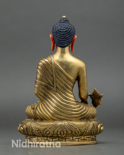 Back view Bhaisajyaguru copper statue intricate details Nepalese sacred Buddhist sculpture