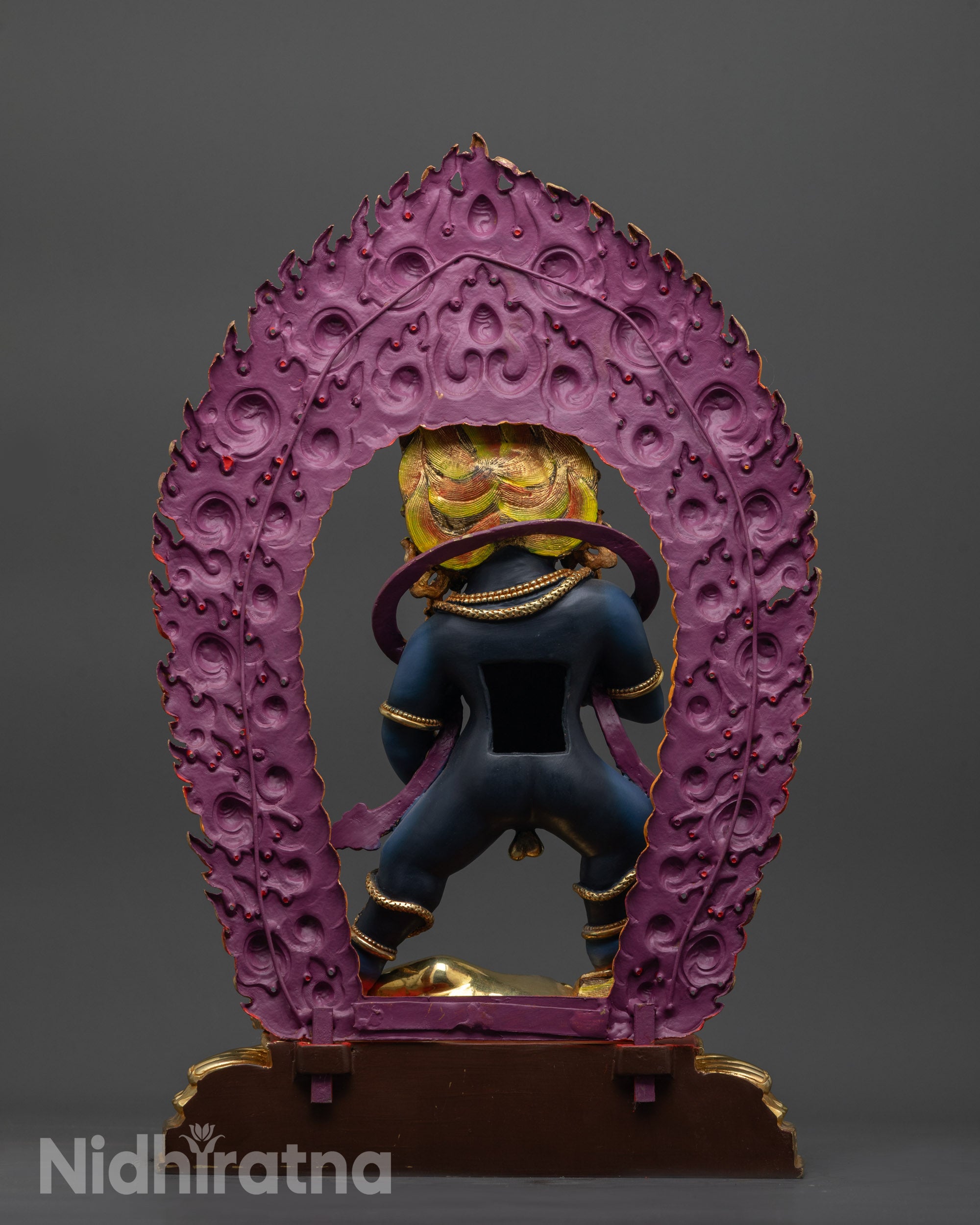 Back view Black Dzambhala statue highlighting gold-plated crown and intricate copper body