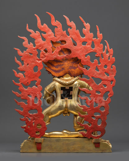 Back view Black Dzambhala statue showing patterns, draped tiger skin, and lotus seat