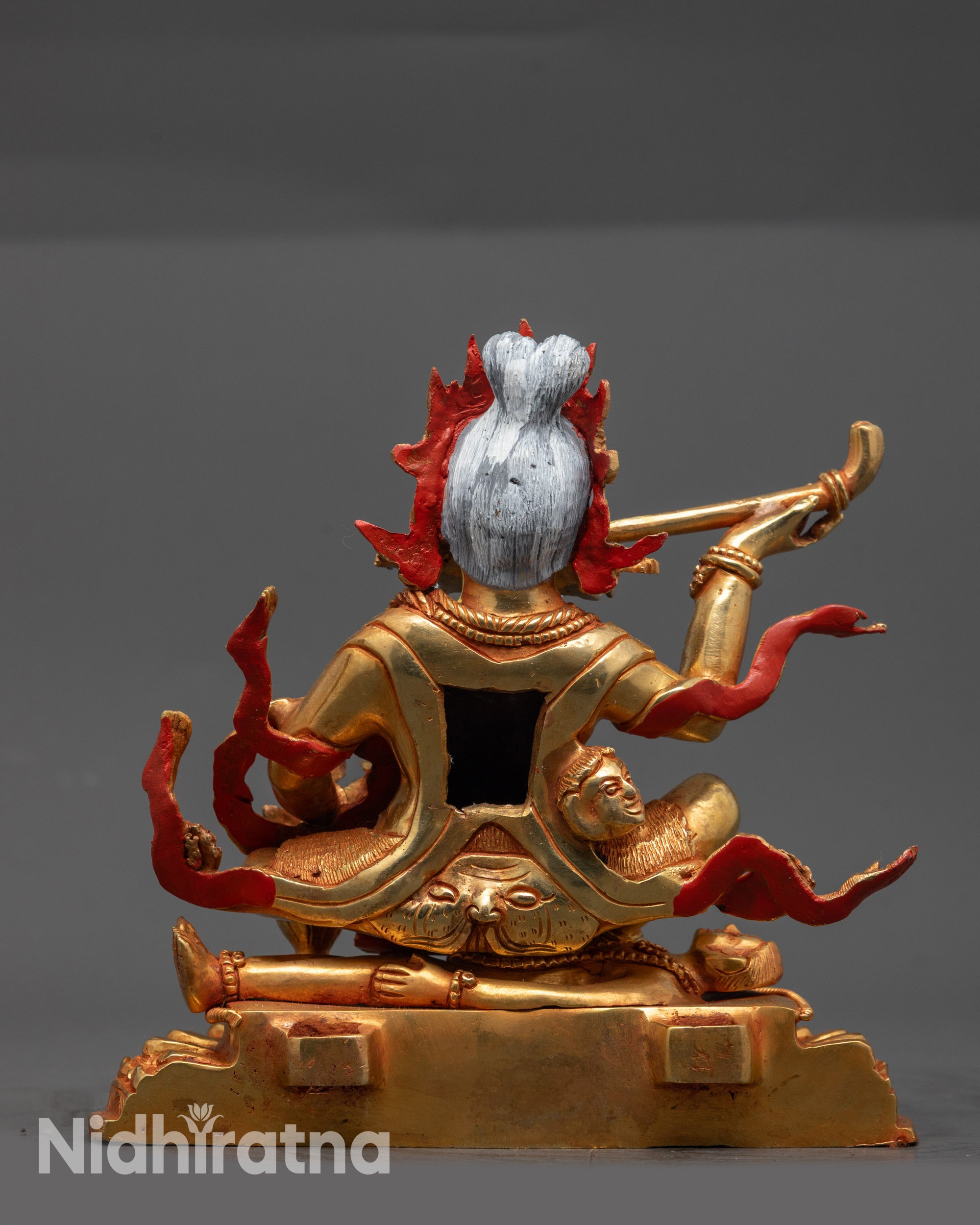 Back view Brahmanrupa Mahakala statue showing tiger skin garments and bone adornments