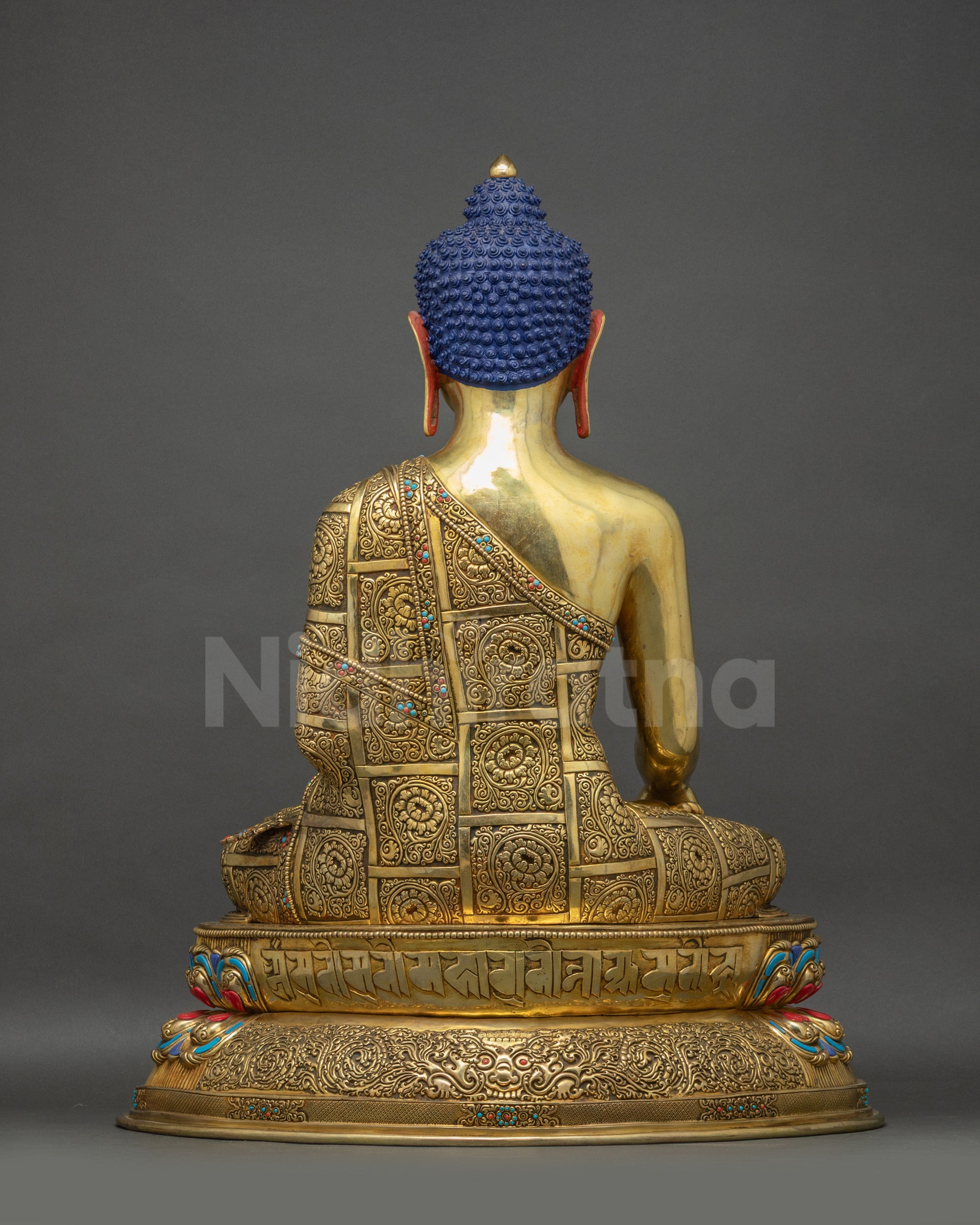 Back view Buddha Shakyamuni Statue showing Uchen mantra and Garuda head on lotus seat