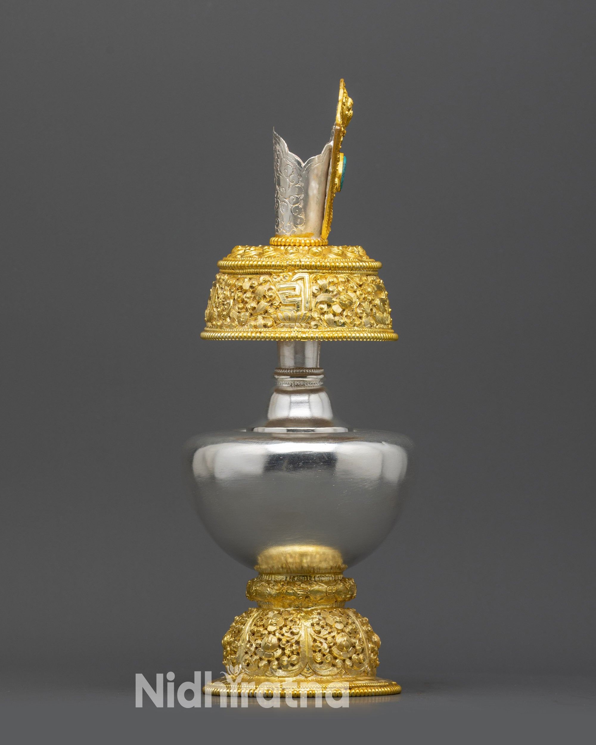 Back view Che Bhumbha ceremonial offering vessel with ornate gold-plated base