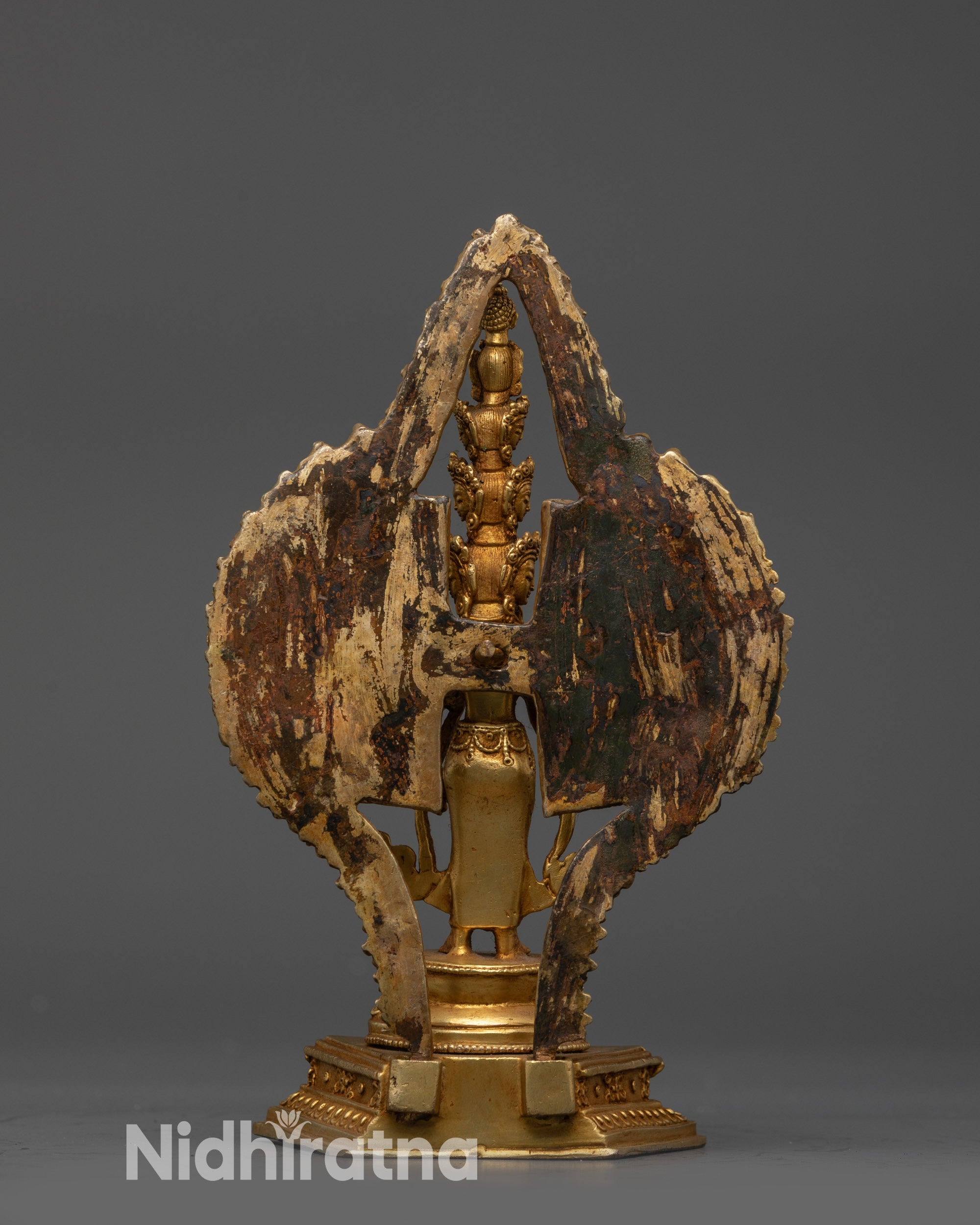 Back view Chenrezig Statue gold-gilded copper with carved halo and lotus motifs