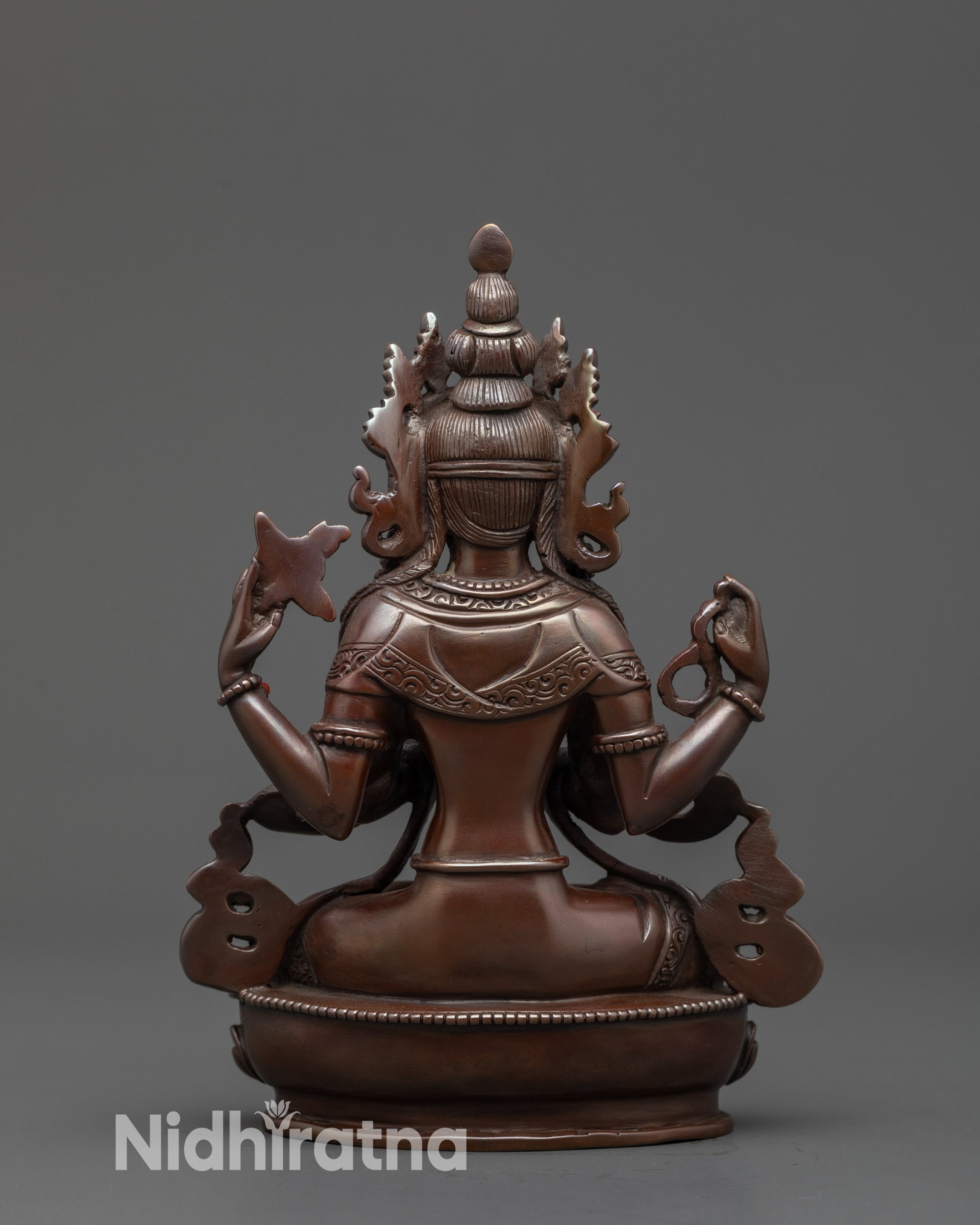 Back view Chenrezig Statue with intricate hand-carved patterns and brownish hue