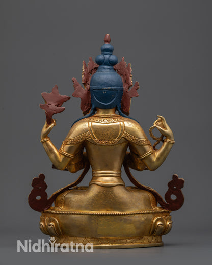 Back view Chenrezig sculpture showing swirling robe patterns and lotus seat details