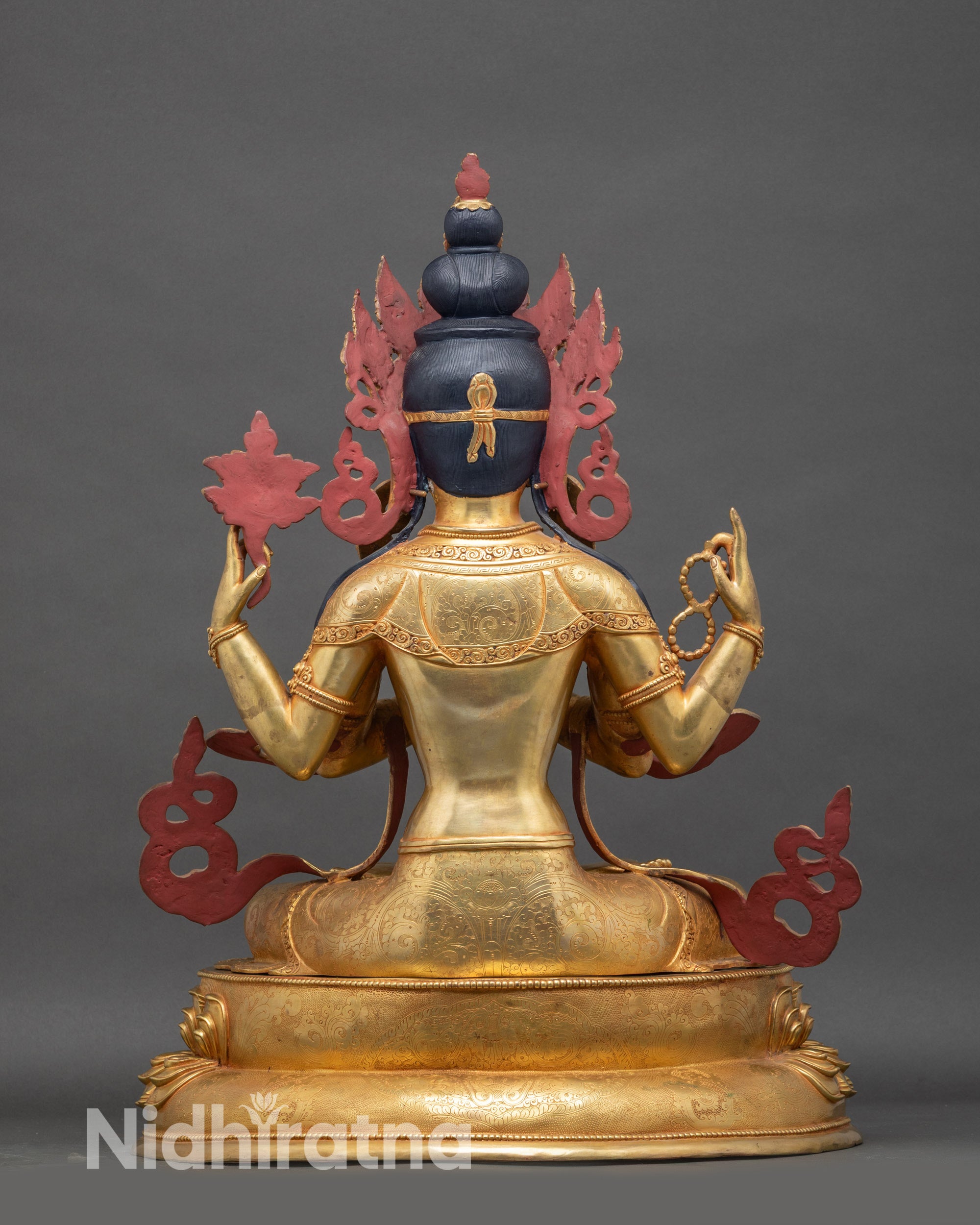 Back view Chenrezig statue, handmade Nepalese Buddhist sculpture with flowing robes