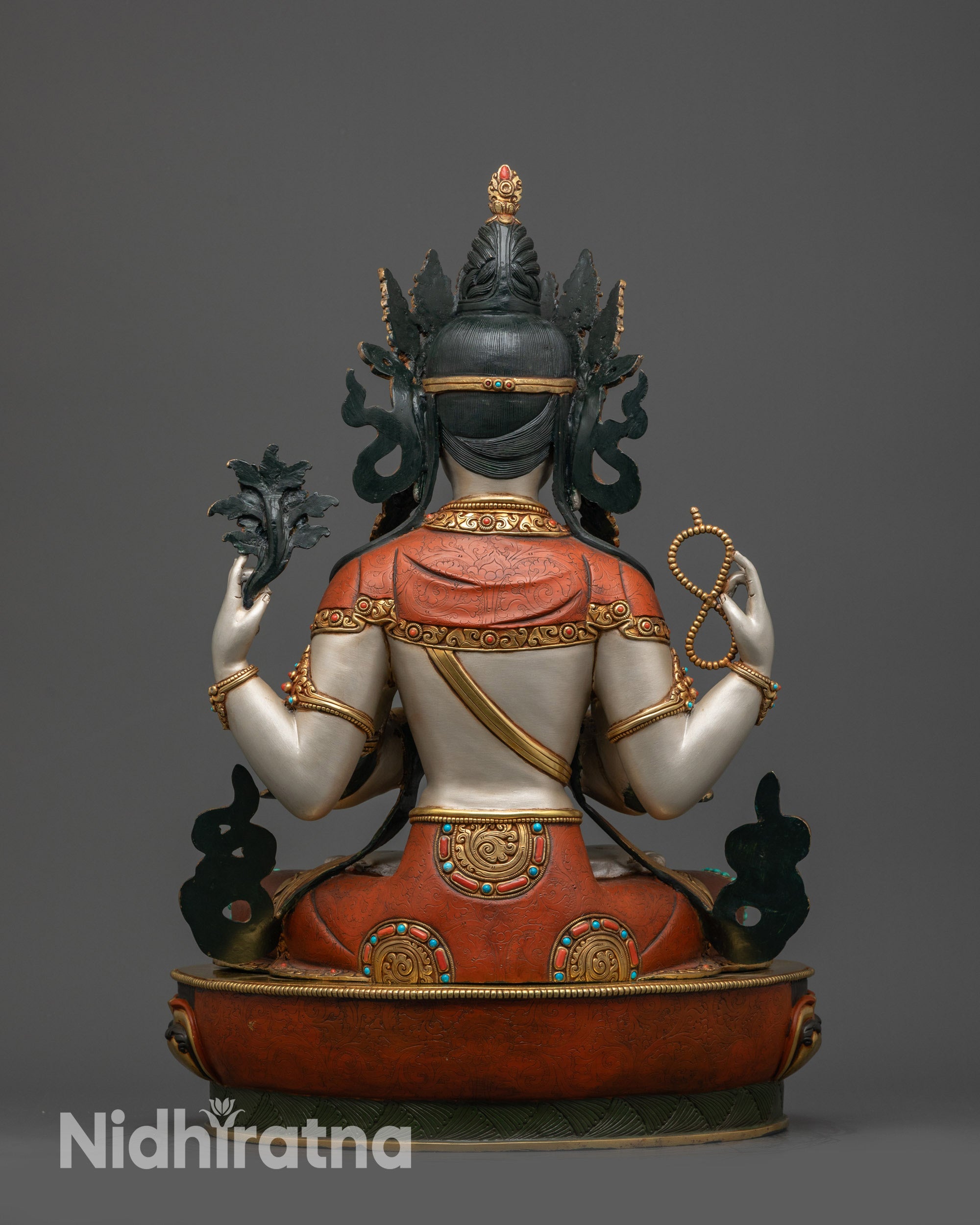Back view Chenrezig statue showing gold-plated robe and patterned copper alloy base