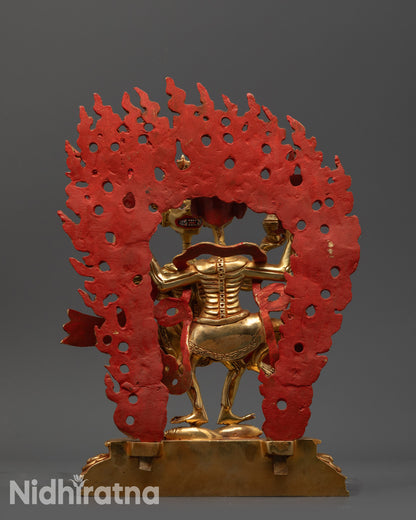 Back view Dancing Chitipati statue showing dynamic pose and blazing halo on copper base