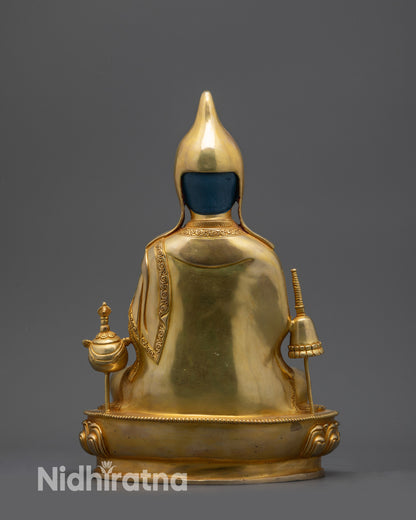 Back view Dipankara Atisha statue showing intricate robe and garment carvings

