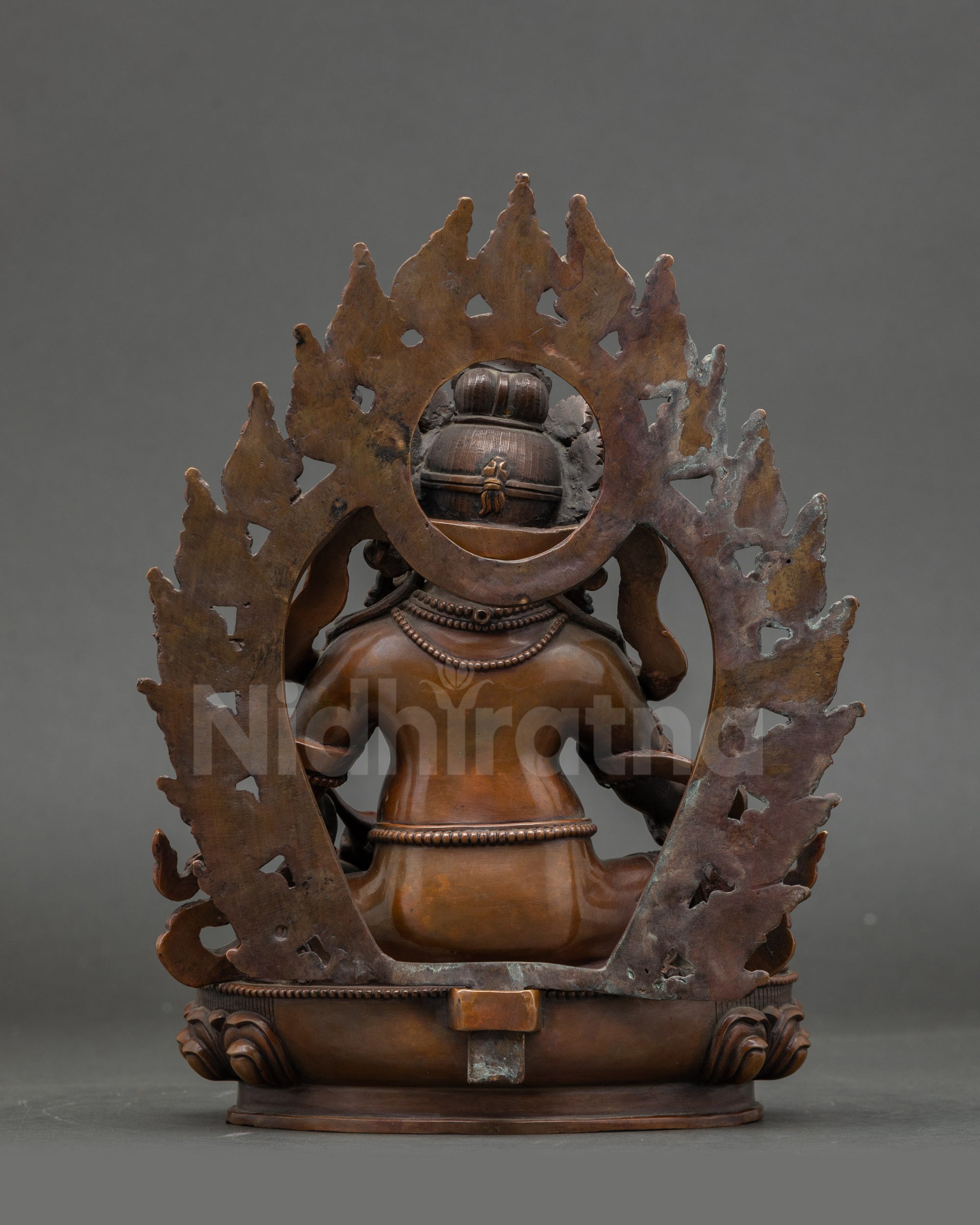 Back view Dzambhala statue with detailed lotus seat, handcrafted in Patan Nepal