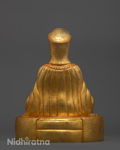 Back view Gampopa Statue with intricate robe carvings and gold fire gilded copper base