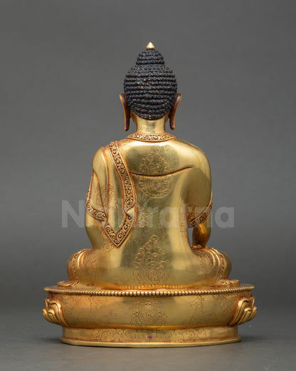 Back view Gautama Shakyamuni Buddha statue gold-gilded copper detailed robe design Nepal
