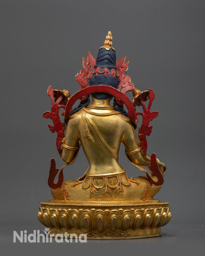 Back view Green Tara statue highlighting intricate carved jewelry and flowing robe