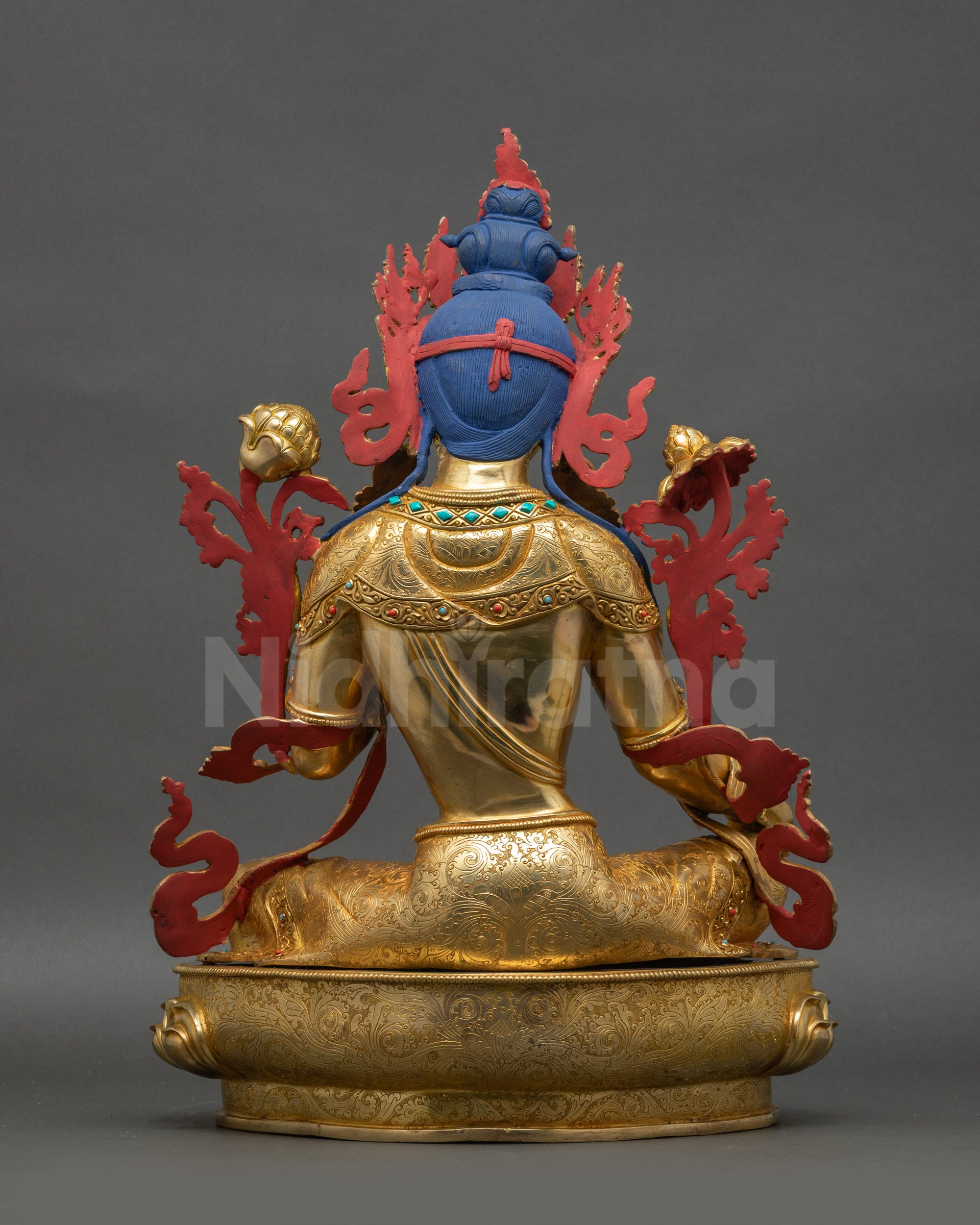 Back view Green Tara statue revealing detailed carving and copper alloy finish