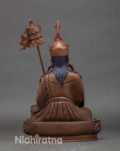 Back view Guru Norlha sculpture, handcrafted Nepalese Buddhist statue with oxidized finish