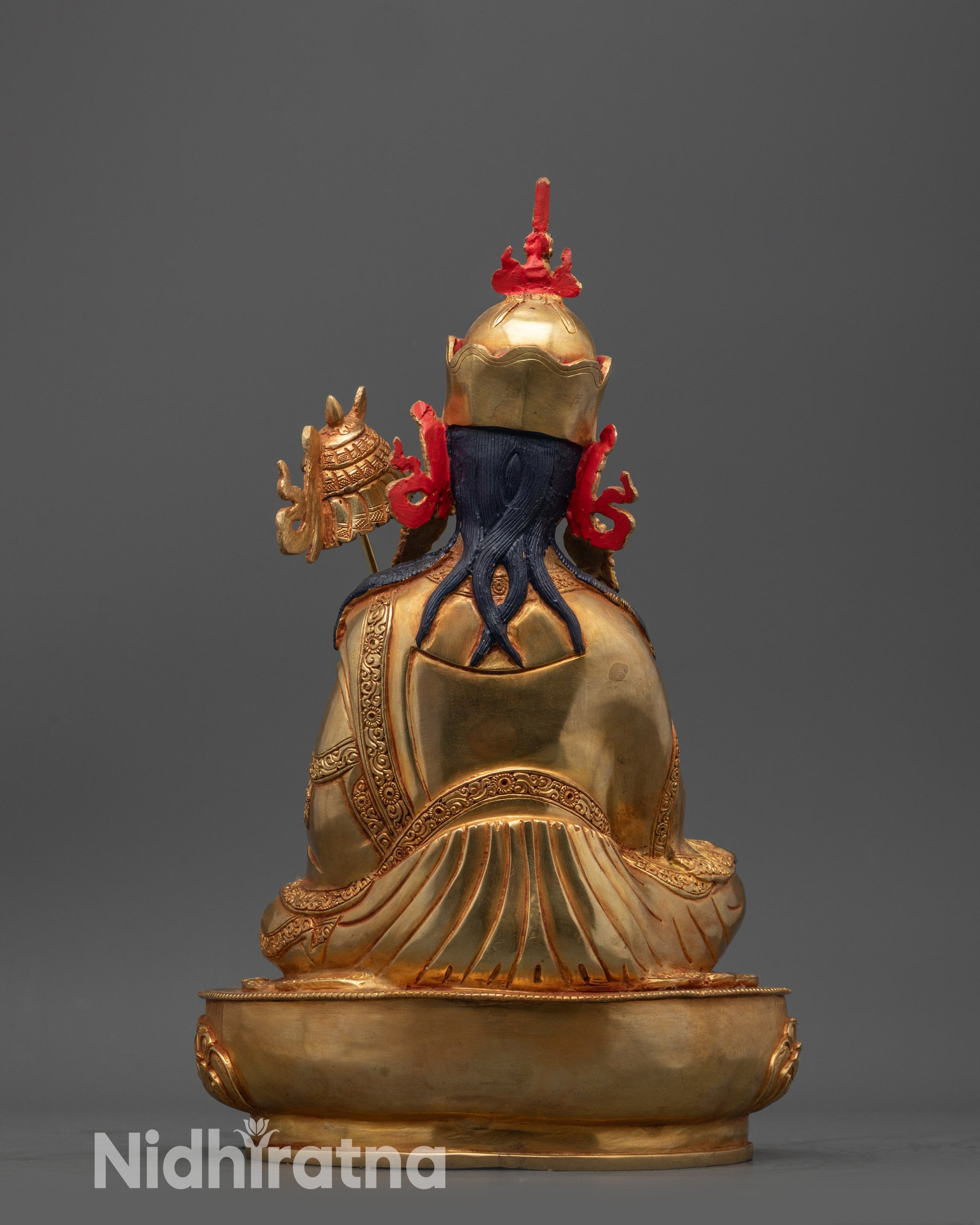 Back view Guru Norlha statue handcrafted copper base with intricate robe carvings