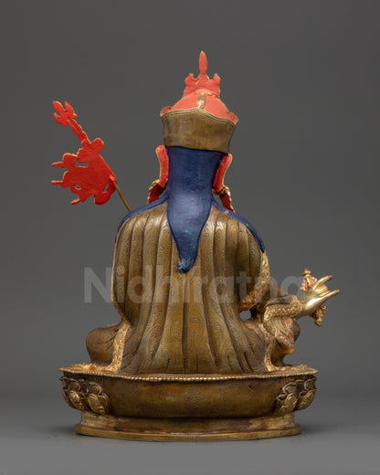 Back view Guru Padmasambhava statue revealing intricate kasaya robe and lotus seat