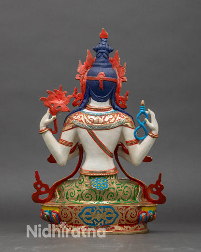 Back view Himalayan Chenrezig statue seated on decorative lotus base with vibrant colors