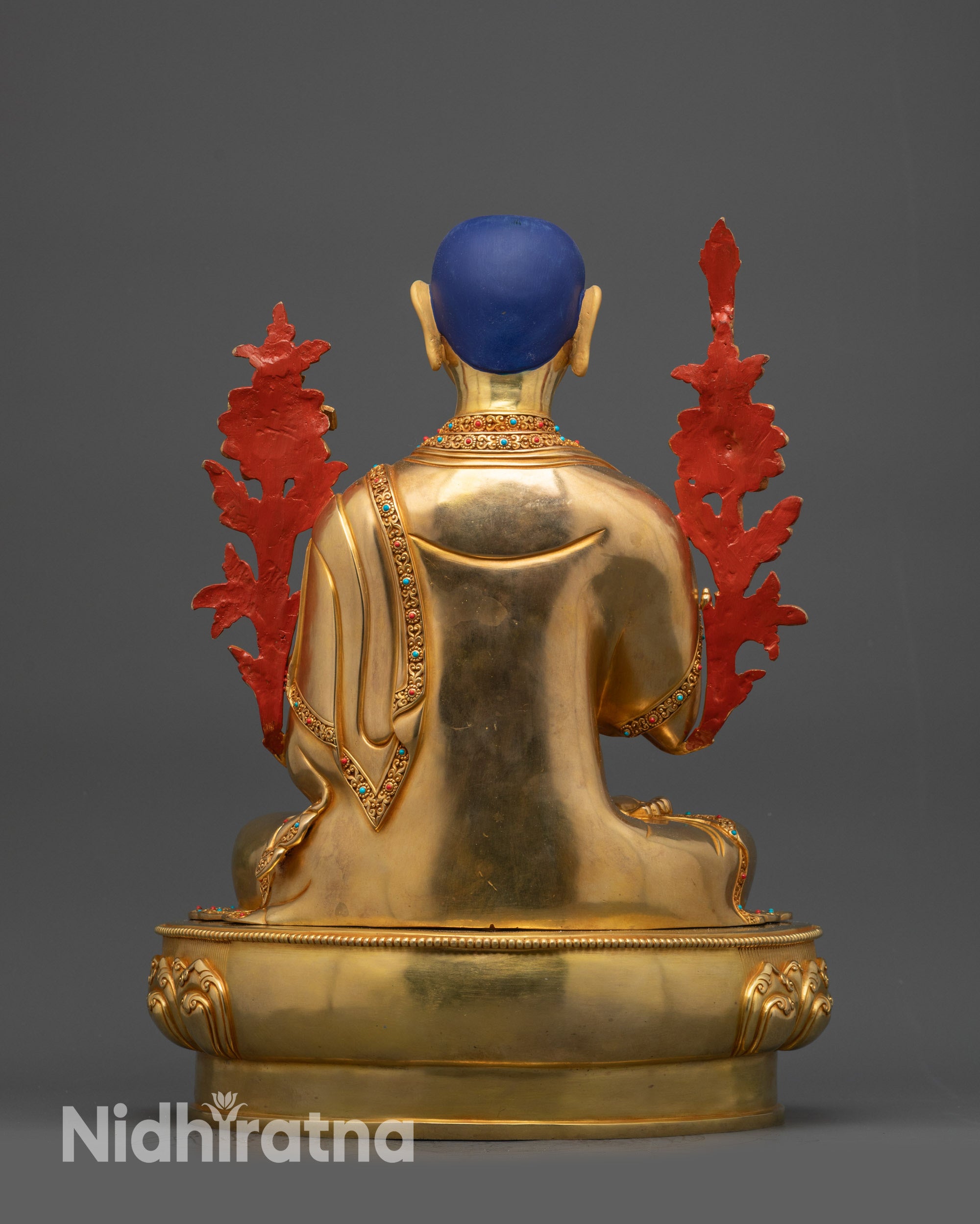 Back view Je Tsongkhapa Statue showing carved robe patterns and polished finish
