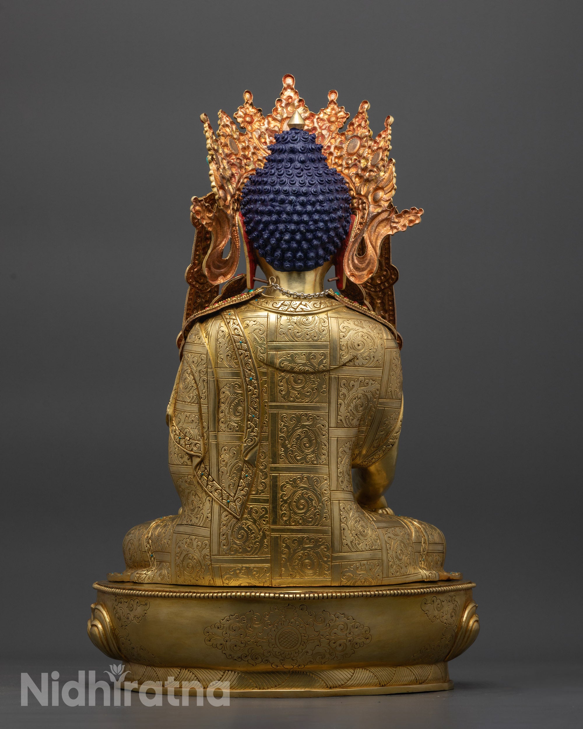 Back view Jowo Rinpoche Buddha Statue displaying carved motifs and copper alloy base