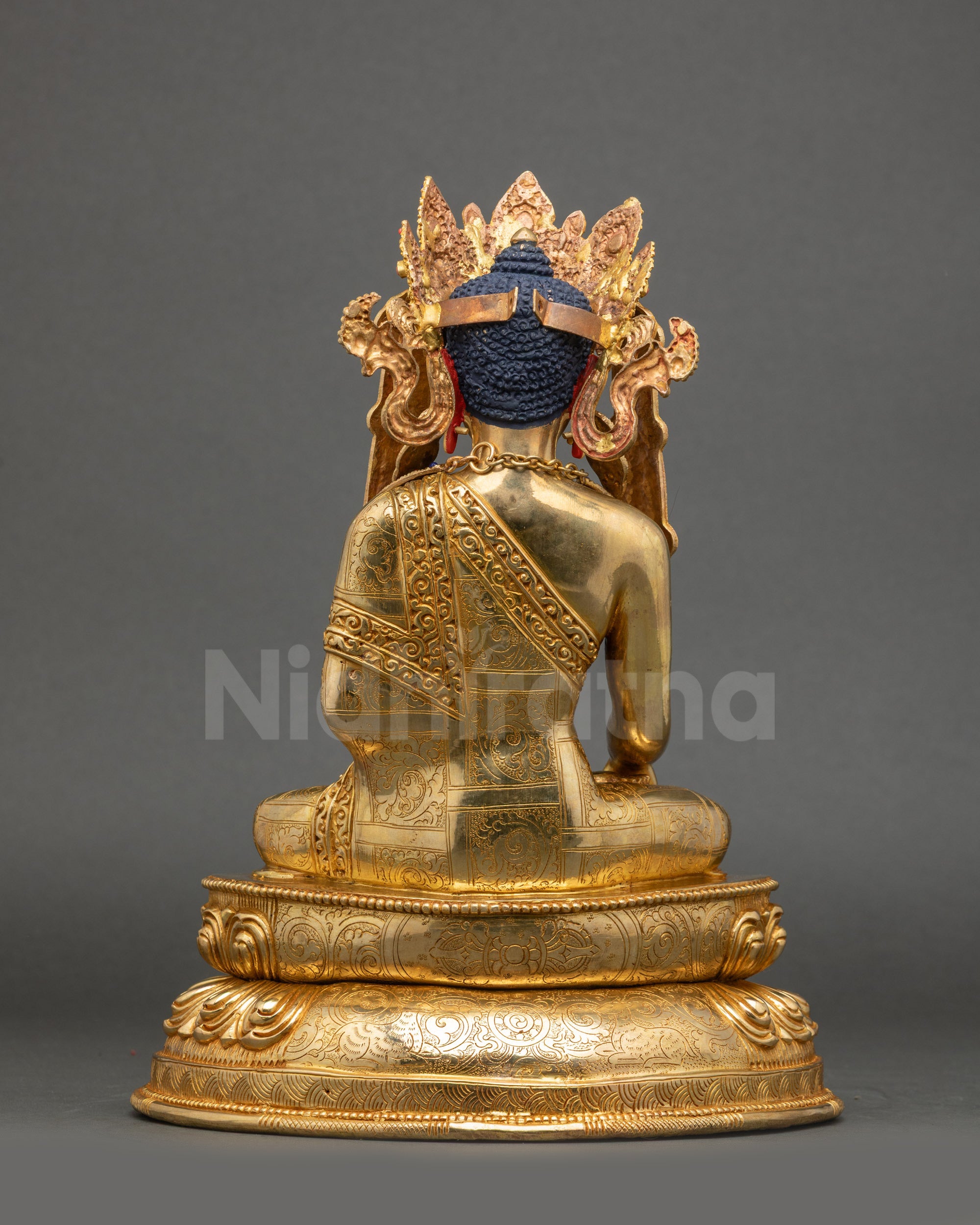 Back view Jowo Rinpoche Statue with intricately carved Buddhist floral motifs
