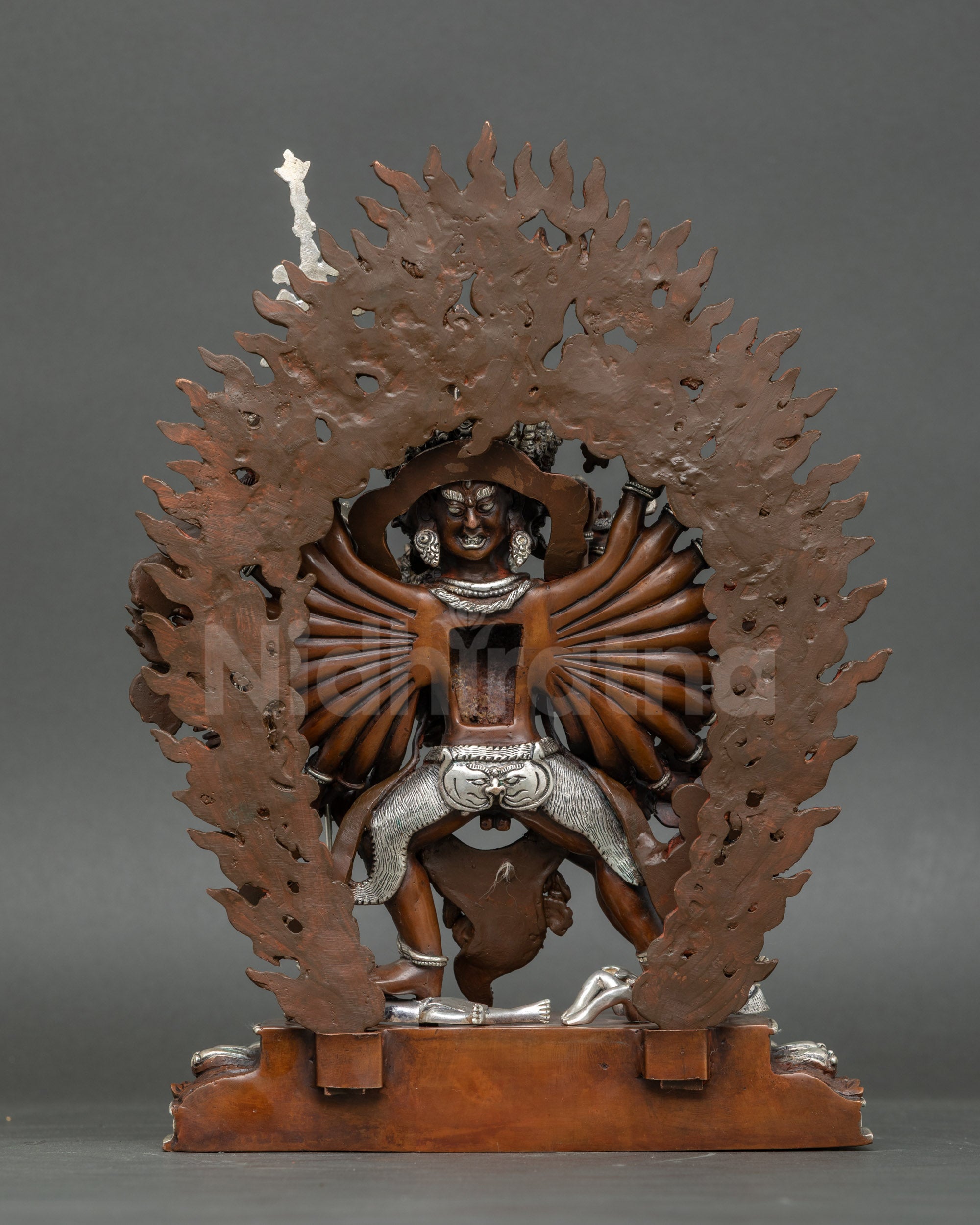 Back view Kalachakra statue blazing aureole oxidized copper Himalayan craftsmanship