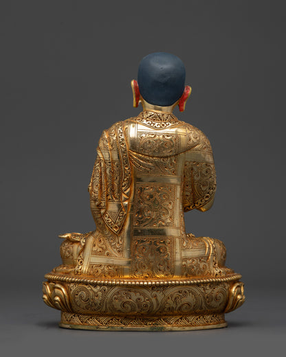 Back view Khedrup Je statue highlighting detailed carvings and lotus pedestal