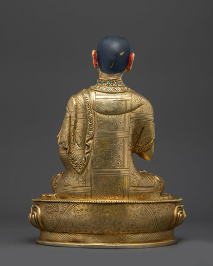 Back view Khedrup Je statue highlighting detailed carvings and sacred base