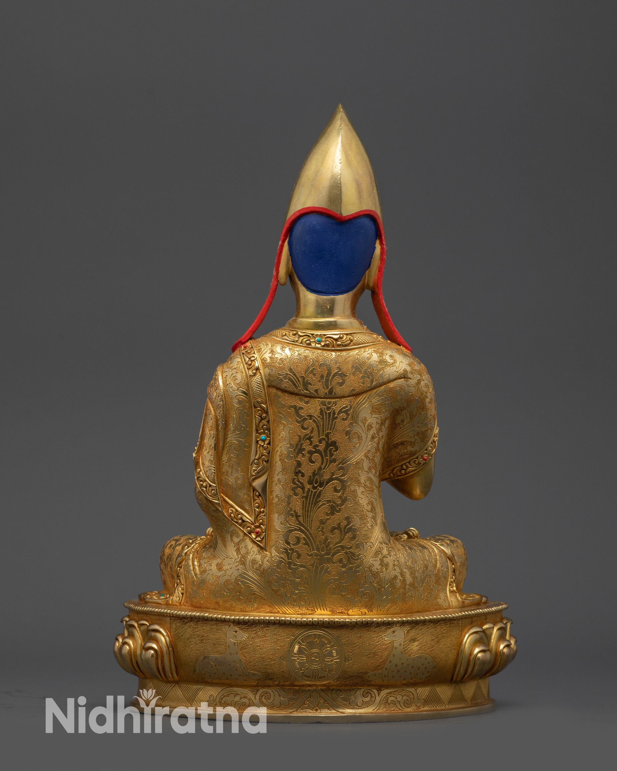 Back view Khedrup statue with detailed carvings, robe folds, and lotus throne