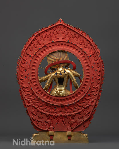 Back view Kurukulla statue highlighting gold fire-gilded body and blazing halo from rear angle