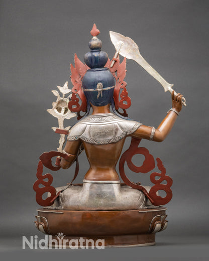 Back view Manjushree statue highlighting Newari craftsmanship and intricate double lotus throne