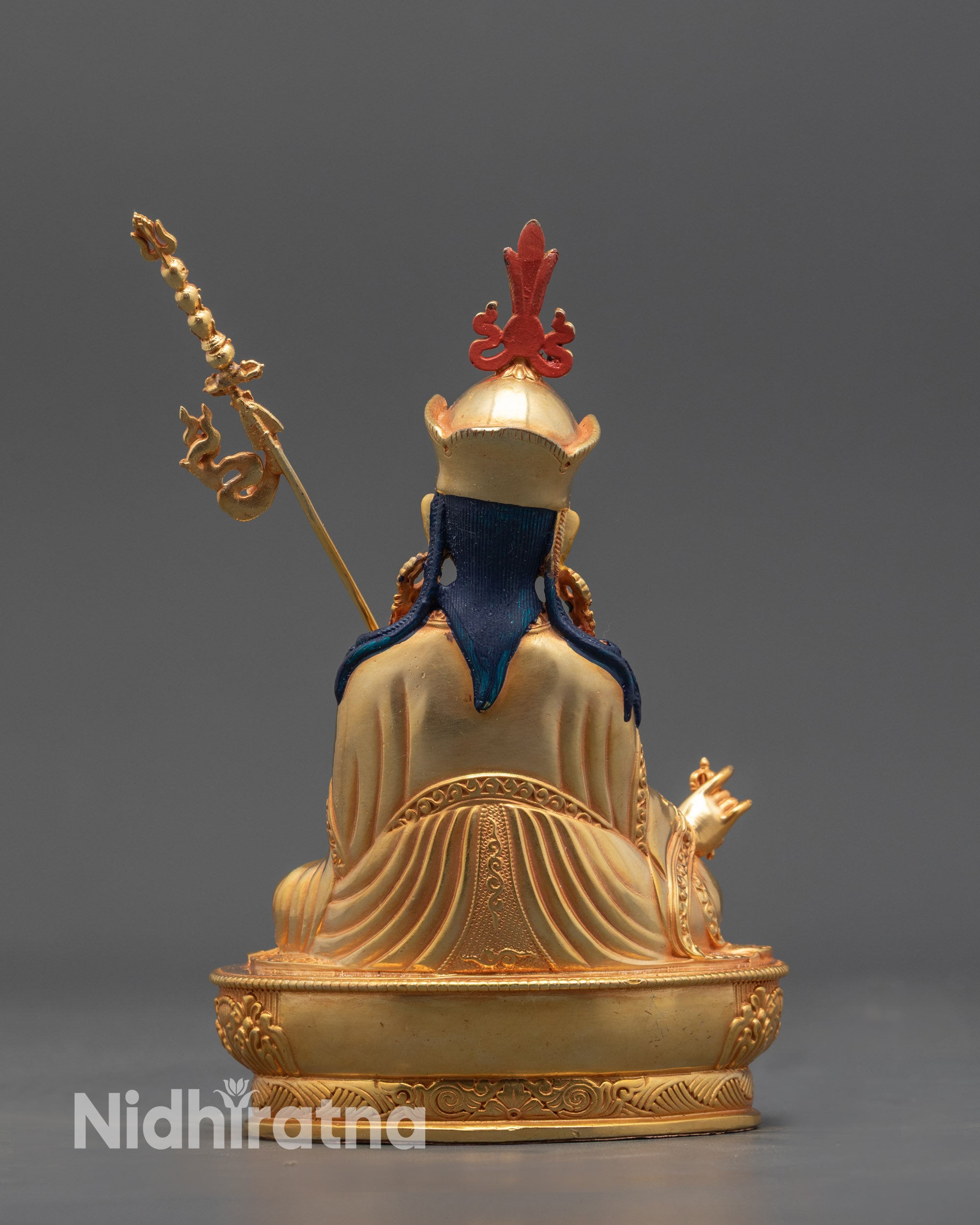Back view Nepalese Padmasambhava sculpture with detailed carved robe and lotus base