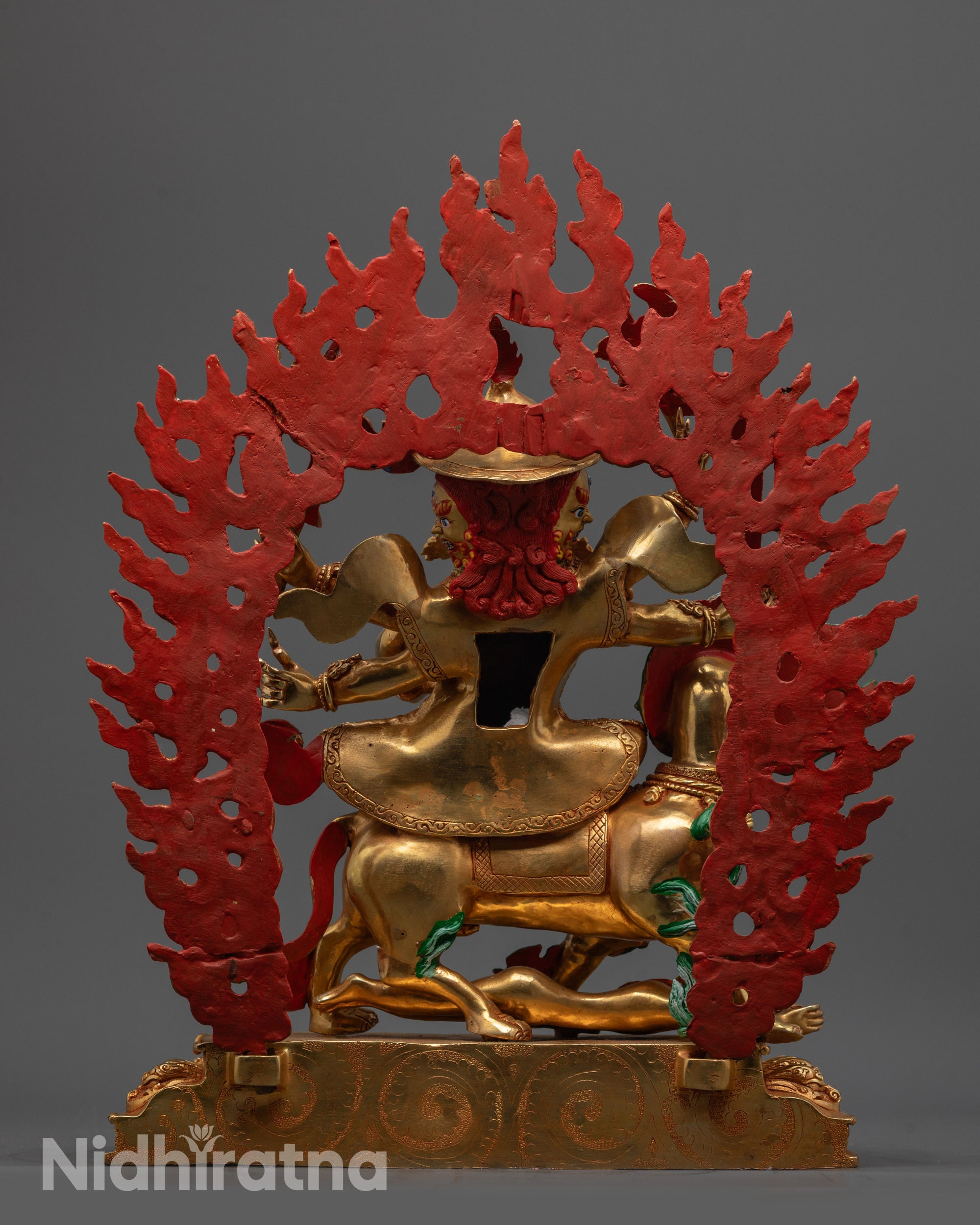 Back view Pehar Gyalpo statue highlighting gold fire-gilded body and ornate craftsmanship